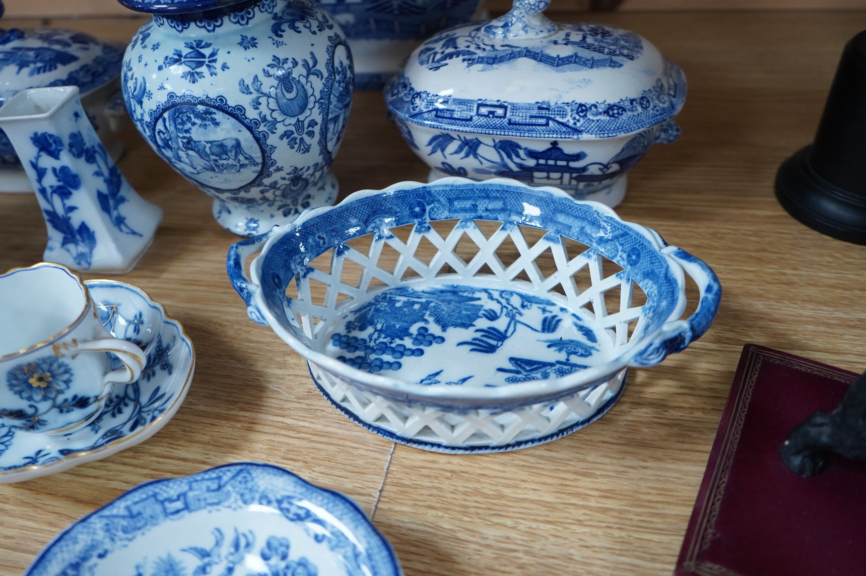 A group of blue and white Willow pattern china, 19th century and later and a Meissen cup and. Saucer. (12).